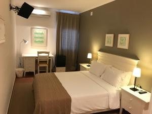 Postel nebo postele na pokoji v ubytování Casas de Luanda-GH Kinaxixe
