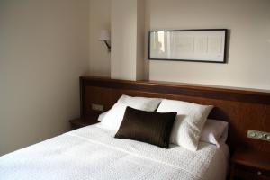 Postel nebo postele na pokoji v ubytování Hotel San Sebastián Hospedería