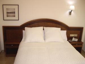 Postel nebo postele na pokoji v ubytování Hotel San Sebastián Hospedería