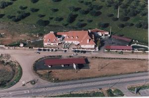 an overhead view of a large house with a road at Hotel Jardim in Elvas
