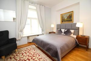 A bed or beds in a room at Tallinn City Apartments - Old Town