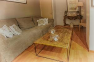 a living room with a couch and a coffee table at Hotel Santa Maria in Saint-Florent