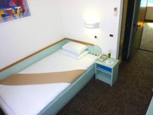 Postel nebo postele na pokoji v ubytování Lipa, Hotel & Bistro