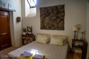 A bed or beds in a room at Il Bosso di Toscana