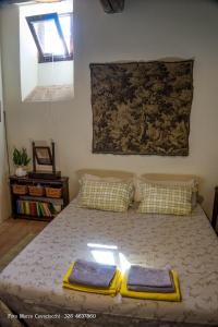 A bed or beds in a room at Il Bosso di Toscana