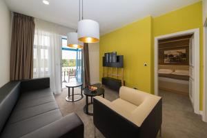 TV a/nebo společenská místnost v ubytování Boutique Hotel Esplanade