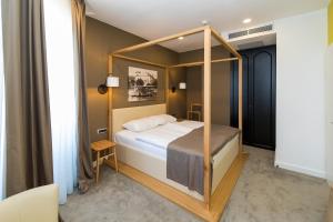 Postel nebo postele na pokoji v ubytování Boutique Hotel Esplanade