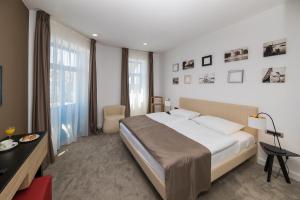 Postel nebo postele na pokoji v ubytování Boutique Hotel Esplanade