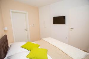 Postel nebo postele na pokoji v ubytování Villa Orljak