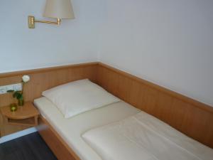 Voodi või voodid majutusasutuse Mirage City Hotel Stuttgart Zentrum toas