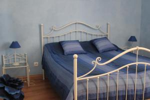 Кровать или кровати в номере La Demeure de Bayard