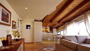 a living room with a couch and a dining room at Residence Darsena in Cattolica