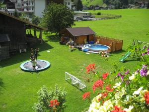 an aerial view of a backyard with a swimming pool at Brollerhof in Neustift im Stubaital