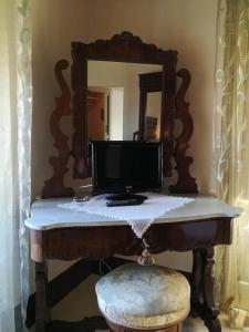TV a/nebo společenská místnost v ubytování B&B Palazzo Gambino