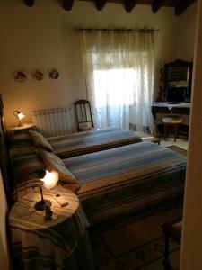 Postel nebo postele na pokoji v ubytování B&B Palazzo Gambino