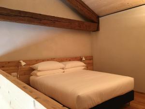Postel nebo postele na pokoji v ubytování Agriturismo Corte Bertesina
