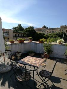 Balkón nebo terasa v ubytování B&B Palazzo Gambino