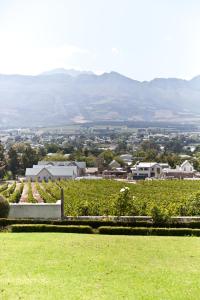 a view of a town with mountains in the background at d'Olyfboom Guest House B & B in Paarl