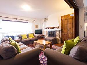 a living room with two couches and a fireplace at Villa El Capricho in Mijas