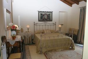 Postel nebo postele na pokoji v ubytování B&B Palazzo Gambino
