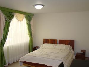 Voodi või voodid majutusasutuse Apartahotel Vincent Suites toas