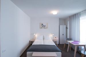 Ένα ή περισσότερα κρεβάτια σε δωμάτιο στο Victoriei City Studios