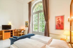Postel nebo postele na pokoji v ubytování Grandhotel Esplanade