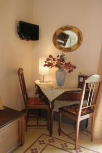 TV a/nebo společenská místnost v ubytování B&B Palazzo Gambino