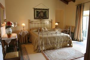 Postel nebo postele na pokoji v ubytování B&B Palazzo Gambino