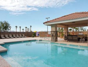 a large swimming pool with a gazebo at Microtel Inn & Suites by Wyndham Wellton in Wellton