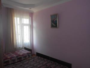 Rúm í herbergi á Seaside House Kobuleti