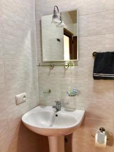 a bathroom with a sink and a mirror at BSG Rustaveli 184 in Kobuleti +87 photos