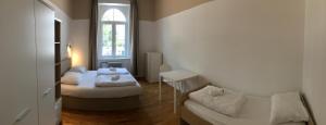 Letto o letti in una camera di C - Punkt Hostel