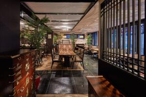 a dining room with a table and chairs at Centurion Hotel&Spa Ueno Station in Tokyo