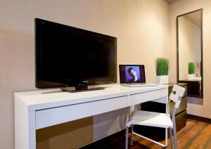 A television and/or entertainment centre at Alura Inn