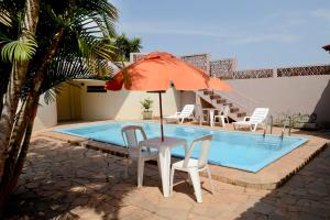 The swimming pool at or close to Hotel Pousada Jaguariuna