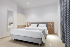 Postel nebo postele na pokoji v ubytování Zephyros Hotel