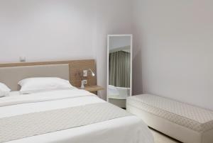 Postel nebo postele na pokoji v ubytování Zephyros Hotel