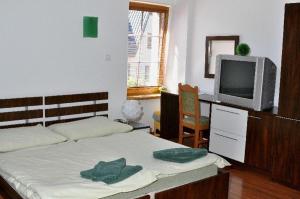 Postel nebo postele na pokoji v ubytování Penzion Stara Fara