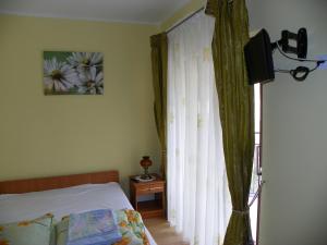 Postel nebo postele na pokoji v ubytování Dom Goscinny Andy