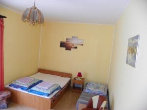 Postel nebo postele na pokoji v ubytování Dom Goscinny Andy