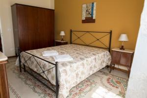 Tempat tidur dalam kamar di Casa Arco Antico