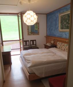 Postel nebo postele na pokoji v ubytování Hotel Cristallo