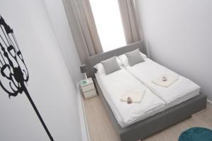 Posteľ alebo postele v izbe v ubytovaní Apartament Pod Kopernikiem II