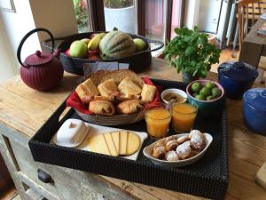 a table with two trays of food on a table at Villa des Roses Voltaire in Brussels +12 photos