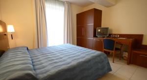 Postel nebo postele na pokoji v ubytování Park Hotel Tyrrenian