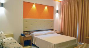 Postel nebo postele na pokoji v ubytování Park Hotel Tyrrenian