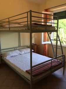 a bedroom with two bunk beds in a room at Agriturismo Valdolivo in Cogoleto