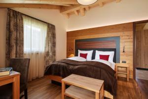 A bed or beds in a room at Residence La Selva