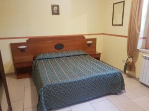 Postel nebo postele na pokoji v ubytování B&B Antica Trattoria